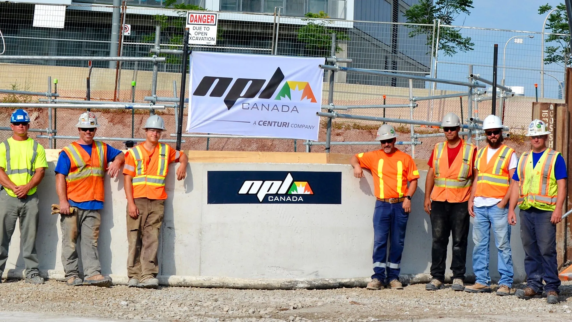 NPL construction workers standing side by side